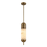 The Zerith LED Fluted Tube Alabaster Single Pendant Light features a brushed brass finish and an alabaster shade, suspended from a brass rod and ceiling mount, providing a soft white glow.