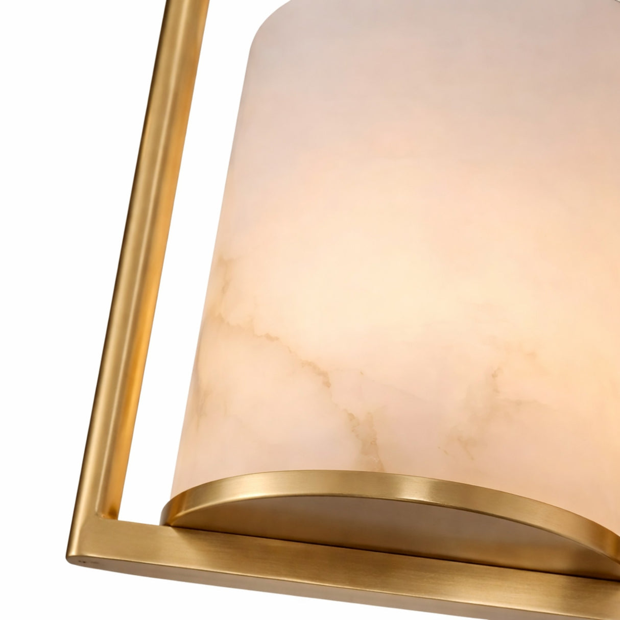 Close-up of the Halorin 1 Light Framed Alabaster Single Pendant Light featuring a soft white cylindrical shade with subtle marbling and a brushed brass frame, emitting warm, inviting light.