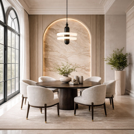 Elegant dining room with a round dark wood table, six cream cushioned chairs, the Nyxara LED Large Double Tiered Alabaster Pendant Light in soft white & black, large arched window, marble accent wall, and green plants in minimalist vases.
