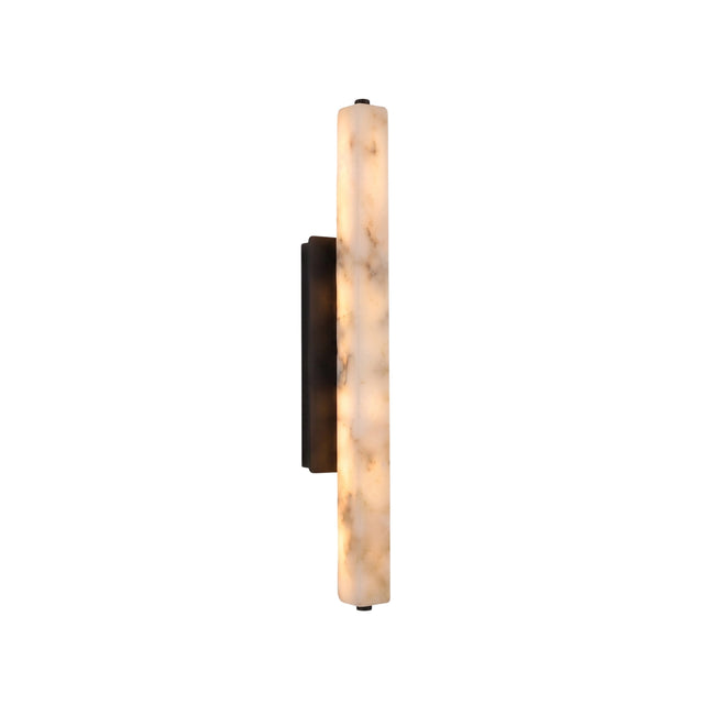 Selvara LED Medium Alabaster Wall Light in Matt Black, a slim vertical column of natural alabaster on a matte black backplate, glowing warm white, shown against a plain white background.