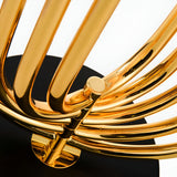 Close-up of the Ascot 4 Light Large Table Lamp in black and gold, featuring modern Art Deco design with curved tubular elements on a black base, set against a white background.