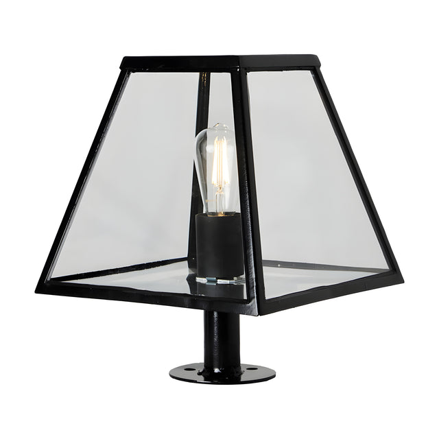 Small Contemporary Pillar Light in black steel with a tapered glass lantern shade and exposed E27 bulb, mounted on a round base plate, shown on a plain white background.