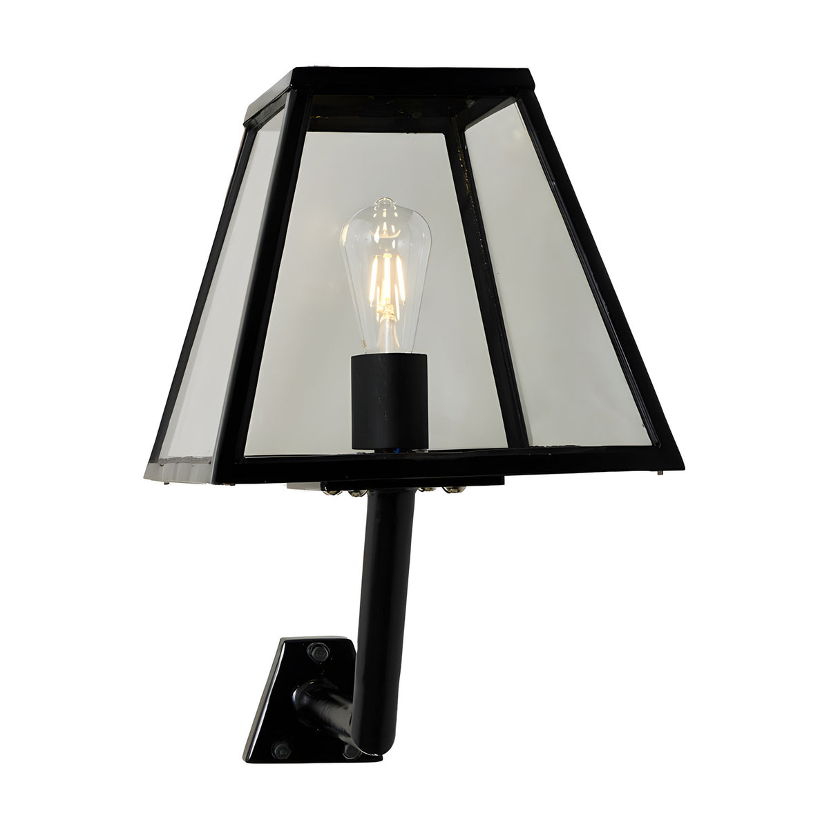 Small contemporary outdoor wall lantern in black steel with clear glass panels, tapered shade, exposed bulb, and angled wall bracket, shown on a plain white background.