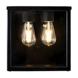 Contemporary Square Box Wall Lantern in black steel with clear glass panels, showing two exposed E27 bulbs inside, on a plain white background.