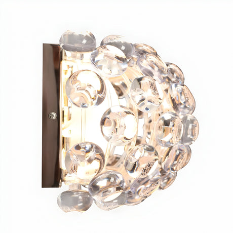 The Briller LED Small Wall Light – Transparent features a rectangular metal base and a curved design with clear glass bubbles, blending contemporary style and elegance for modern interiors.