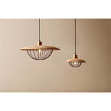Chakai Small Wood & Metal Pendant Light in natural mango wood, shown with a larger matching pendant, each with an open brass cage shade around a visible bulb, against a plain neutral wall.