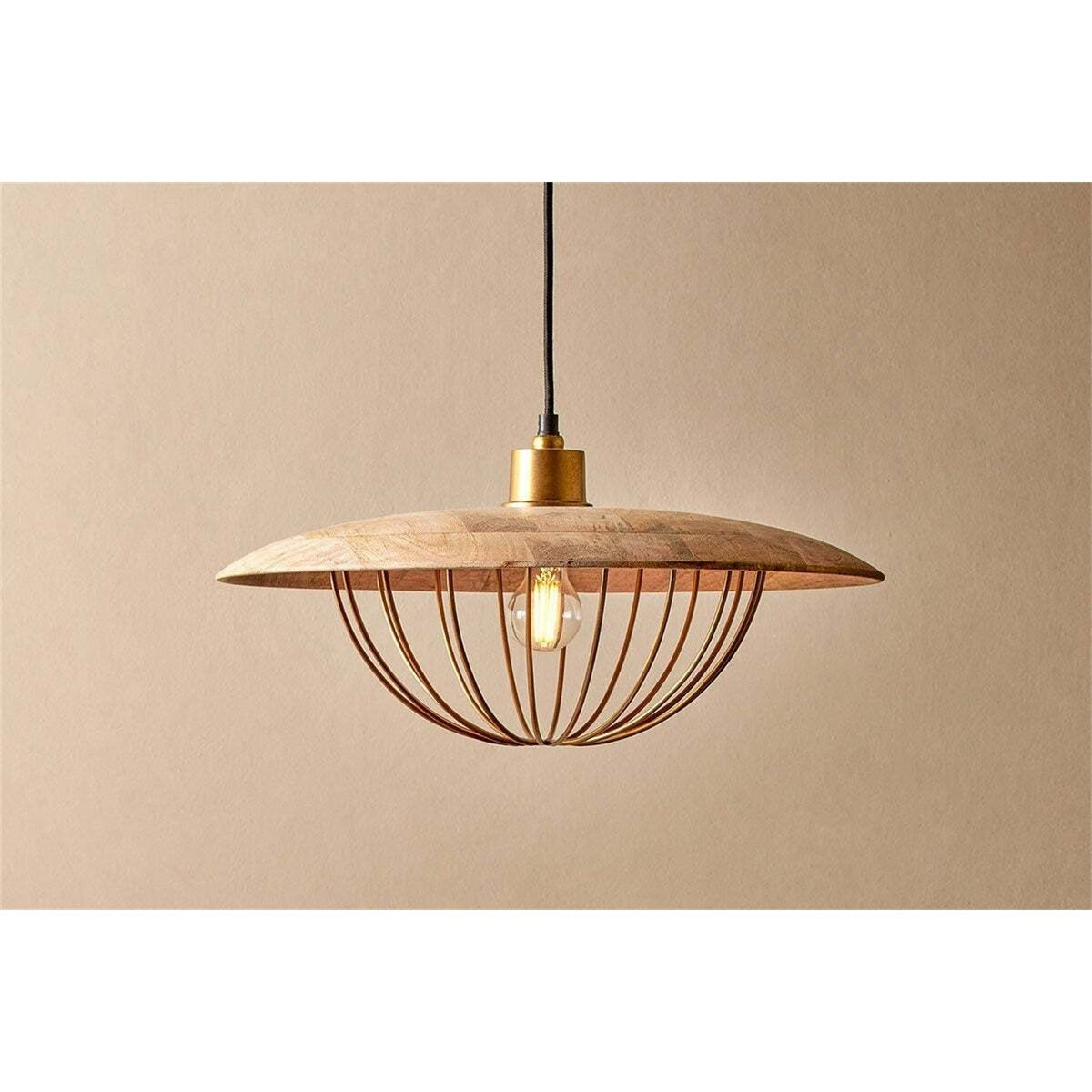 Chakai Large Wood & Metal Pendant Light in natural mango wood, a wide shallow disc shade with an open brass wire cage below holding a single exposed bulb, shown against a plain beige background.