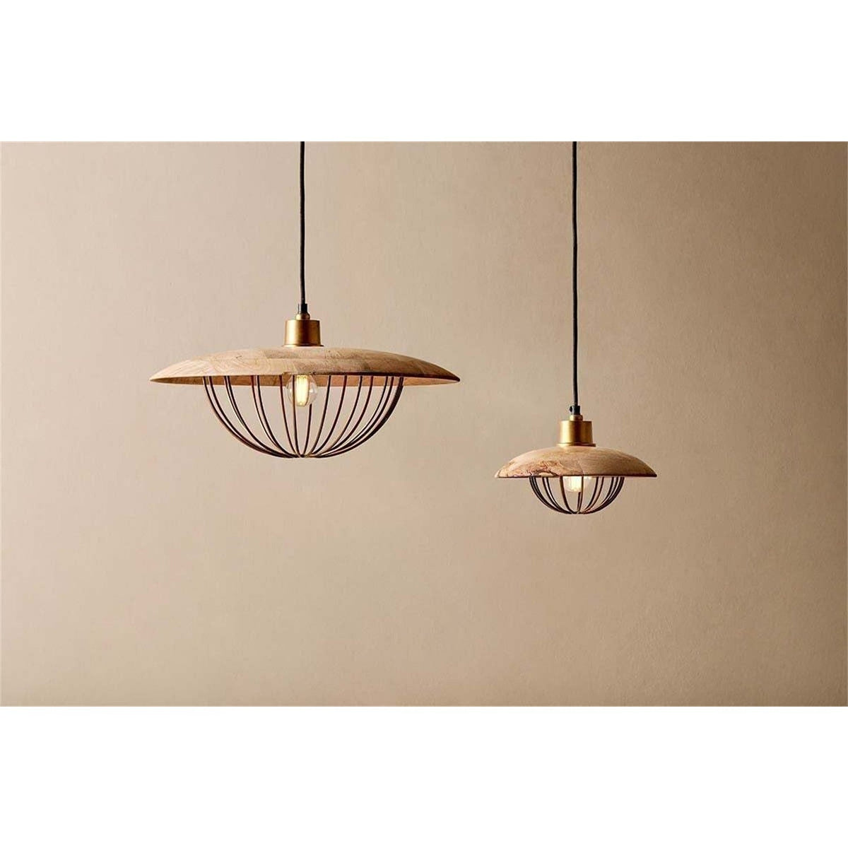 Chakai Large Wood & Metal Pendant Light in natural mango wood, shown with a smaller matching pendant, both featuring wide disc shades and open wire cages below, against a plain beige background.