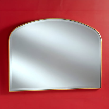 The Camden Overmantle Wall Mirror Gold - 107x79cm, featuring a slim gold frame, is mounted on a vivid red wall. Its sleek design contrasts with the bold background, creating a minimalist and elegant appearance that highlights its high-quality wood craftsmanship.