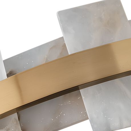 Close-up of overlapping white and gray marble-like panels, echoing the Montyra LED Panelled Alabaster Linear Chandelier in Soft White & Brass, with a diagonal brushed brass strip, set against a white background.