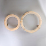 Two round alabaster semi-flush ceiling lights, Orbis Extra Large and a smaller version, shown side by side with brass mounts on a plain white background.