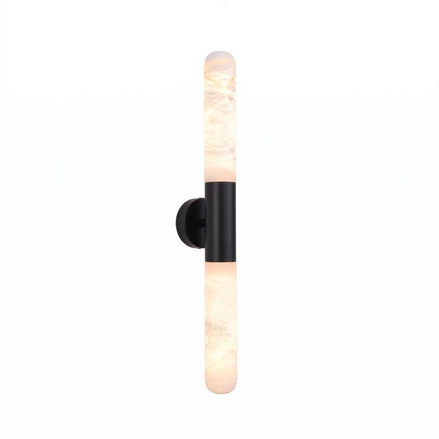 Averin LED Alabaster Wall Light in Matte Black, featuring two vertical alabaster columns joined by a round black centre bracket, shown lit against a plain white background.