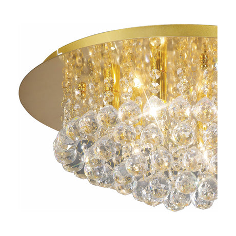 Close-up of the Dahlia 6 Light G9 Flush Ceiling Light in French Gold, 45cm, showing clear crystal balls and strands around a gold canopy on a white background.