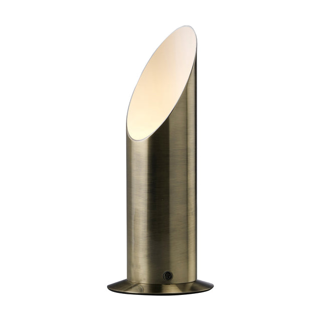 Indio GU10 table lamp in antique brass, a slim cylindrical body with an angled top opening revealing a white interior, set on a round base against a plain white background.