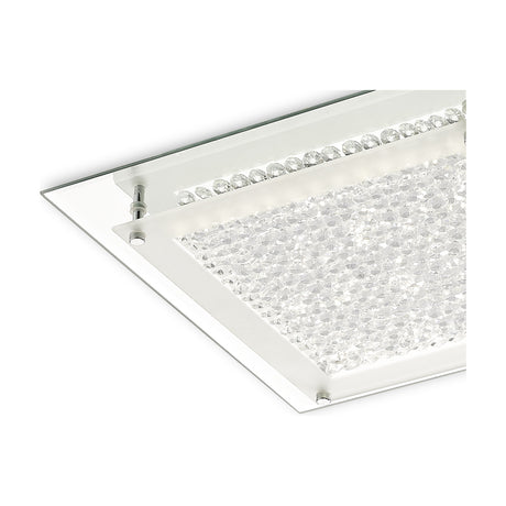 Close-up corner view of the Gina 18W flush ceiling light, showing a square crystal panel in a polished chrome frame with glass edge and integrated LED strip, on a plain white background.