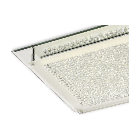 Close-up corner view of the Gina 21W flush ceiling light, showing crystal-filled glass panel with integrated LED strip framed by a polished chrome edge on a white background.