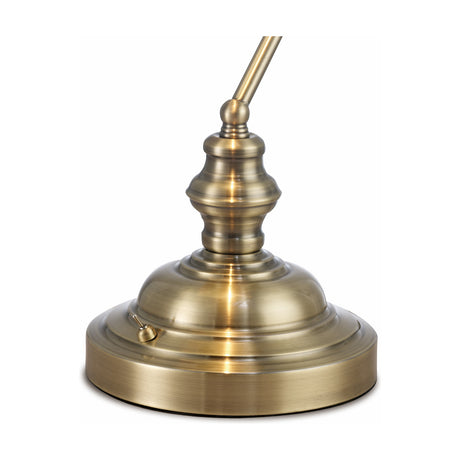 Close-up of the Morgan E27 Table Lamp base in antique brass, showing a turned iron column, adjustable arm joint, and rotary switch on a stepped circular foot, set against a plain white background.