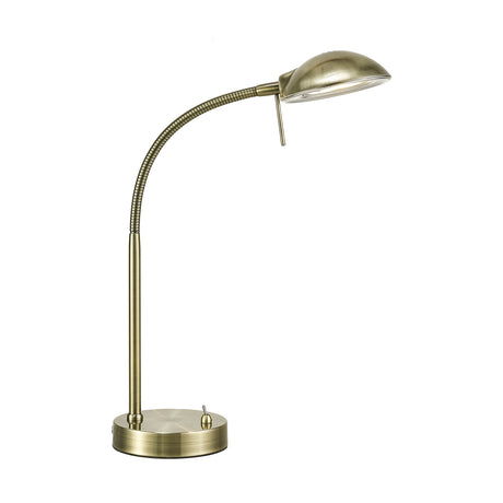 G9 table lamp in antique brass with a curved gooseneck stem, dome-shaped metal shade, toggle switch, and round weighted base, shown on a plain white background.