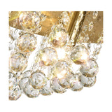 Close-up of the Acton 5 Light E14 Round Flush Ceiling Light, 46cm, showing clear faceted crystal spheres against an antique brass frame with illuminated bulbs.