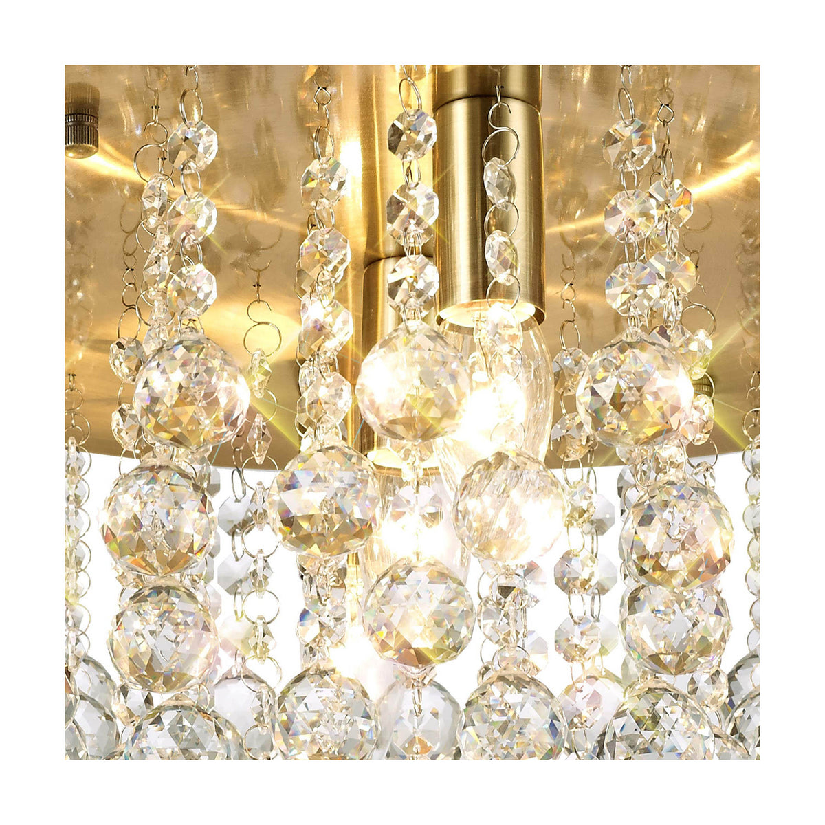 Close-up of the Acton 5 Light E14 Round Flush Ceiling Light in antique brass, showing clear crystal spheres and beaded strands illuminated by candle bulbs.