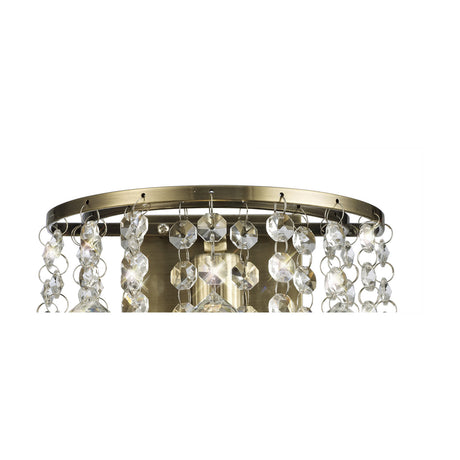 Acton E14 Sphere Crystal Switched Wall Light in antique brass, close-up of the circular frame with cascading crystal strands and a central sphere, shown against a plain white background.