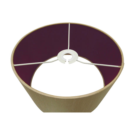 Sigma 30cm drum lamp shade in antique gold faux silk with a deep ruby-purple lining, white spider fitter frame visible, shown on a plain background.