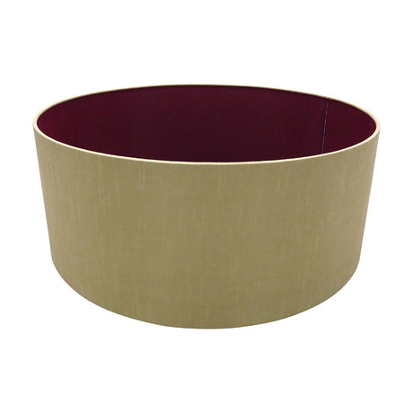 Sigma Lamp Shade 50cm drum-style cylinder in antique gold faux silk with a ruby-red interior lining, shown on a plain white background.