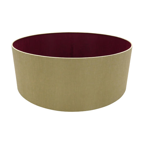 Sigma Lamp Shade 60cm, a wide low cylinder in antique gold faux silk with a ruby red inner lining, shown on a plain white background.