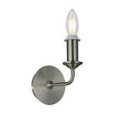 Banyan E14 wall light in satin nickel with a single upward candle bulb holder and curved wall arm on a round backplate, shown on a plain white background.