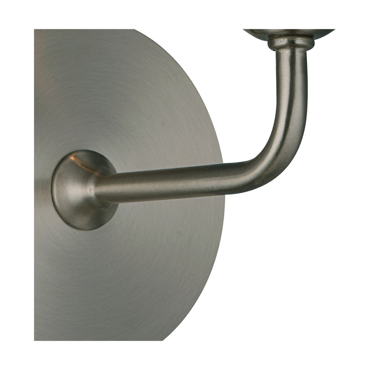 Close-up of the Banyan E14 wall light in satin nickel iron, showing the circular wall mount and curved arm leading to the E14 candle lamp holder.