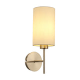 Carlton 1 Light E27 Wall Light in satin nickel, single-arm design with a round wall plate and cylindrical cream fabric shade, shown lit on a plain white background.