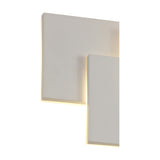 Kiania Rectangular Wall Light 26cm in sand white, close-up view of overlapping square and rectangular panels with warm LED glow along the edges, plain white background.