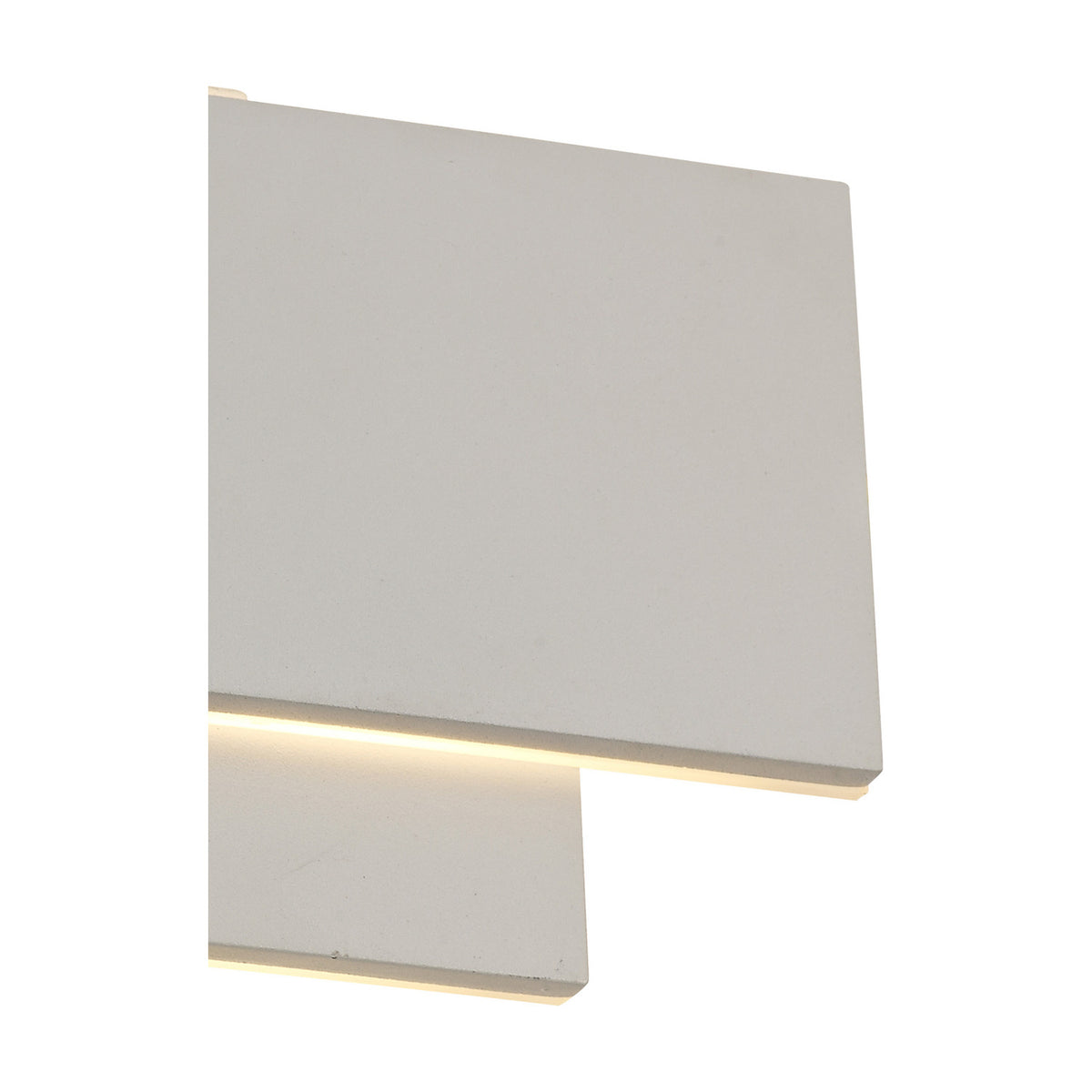 Close-up of the Kiania Rectangular Wall Light in sand white, showing the tiered rectangular panels with a warm white LED strip glowing along the frosted diffuser edge.