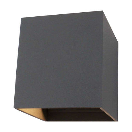 Delia 6W IP54 outdoor wall light, a compact anthracite aluminium cube, 10cm square, shown at an angle on a plain white background with a visible clear diffuser edge.