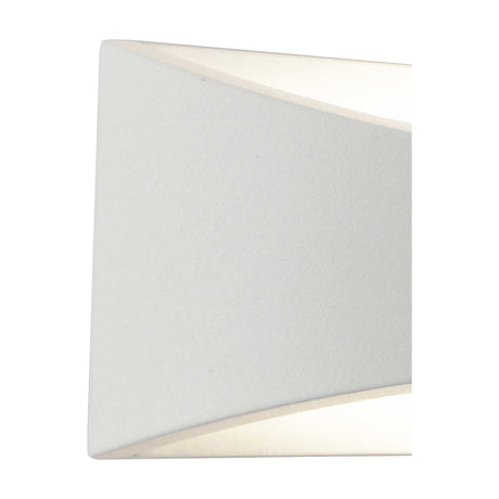 Aryana IP54 outdoor wall light in sand white, close-up of the angular rectangular aluminium body with opal glass lens diffusing warm white LED light, shown on a plain background.