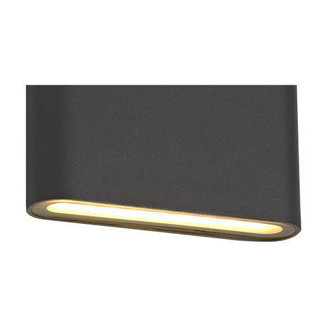 Contour 3W IP54 outdoor wall light in anthracite, a slim rectangular aluminium block with a frosted glass strip emitting warm white downward light, shown at an angle on a plain white background.