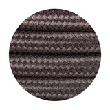 Close-up of Cavo braided copper cable, a grey woven 2-core 0.75mm fabric flex shown in a circular crop against a white background.