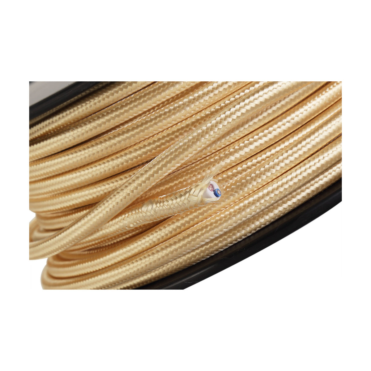 Close-up of Cavo braided gold fabric cable, 2 core 0.75mm copper flex, coiled with one end stripped to reveal inner wires, on black spool.