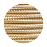 Close-up of Cavo braided copper cable, 2 core 0.75mm, in a gold woven fabric sleeve, shown as parallel lengths against a plain white background.