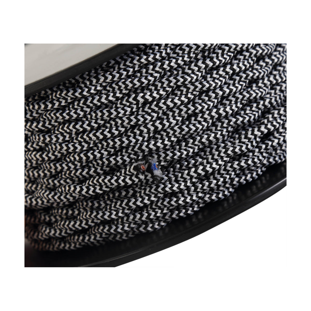 Cavo Wave Stripe Braided Twisted Cable, 2-core 0.75mm fabric flex in black with white zigzag pattern, shown wound on a spool.