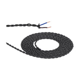 Coiled Cavo braided twisted flex cable in black and white weave with 2 core 0.75mm copper conductors exposed at one stripped end, shown on a white background.