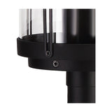 Close-up of the Reva IP44 E27 lamp post in black, showing the clear polycarbonate diffuser with vertical ribs, black cap with screws, and coupling to the pole against a white background.