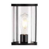 Close-up of the Reva IP44 E27 lamp post's black metal frame and clear polycarbonate diffuser, showing a lit ST64 filament bulb inside on a white background.