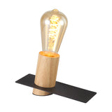 Bret E27 Table Lamp 18cm in black, featuring a cylindrical wood base on a slim black rectangular plate, shown with an ST64 filament bulb on a plain white background.