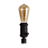 Kork E27 Table Lamp 60mm in black, a compact iron bottle-neck lamp fitting with rotary switch, shown with an amber Edison bulb on a white background.