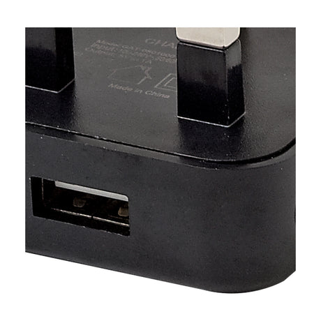 Close-up of the Additions 1A Plug 48mm Long in black, showing the USB output port and moulded pins on a slim polycarbonate body.