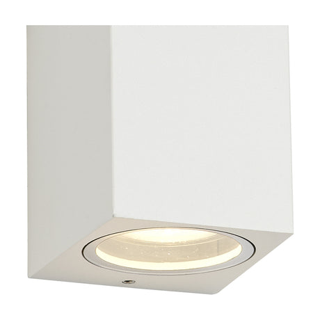 Tomar 2 Light Rectangle Outdoor Wall Light in sand white, cube-shaped die cast aluminium casing with a round clear glass diffuser showing a lit GU10 lamp, shown on a plain white background.
