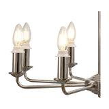 Close-up of the Banyan semi flush ceiling light in champagne gold, showing curved iron arms with candle-style E14 bulbs against a white background.