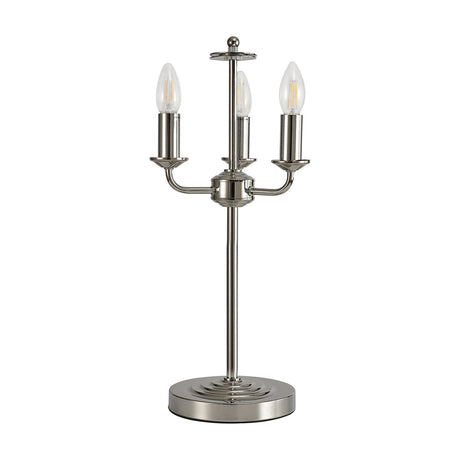 Banyan 3-Light E14 table lamp in polished nickel, iron construction with three candle-style arms, slender stem, and stepped round base, shown with clear filament bulbs.