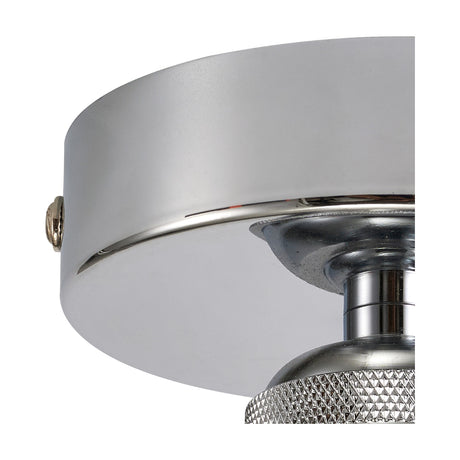 Close-up of the Dreifa E27 ceiling light's 10cm polished chrome base, showing the drum-shaped canopy, fixing screw, and knurled fitting detail against a plain background.